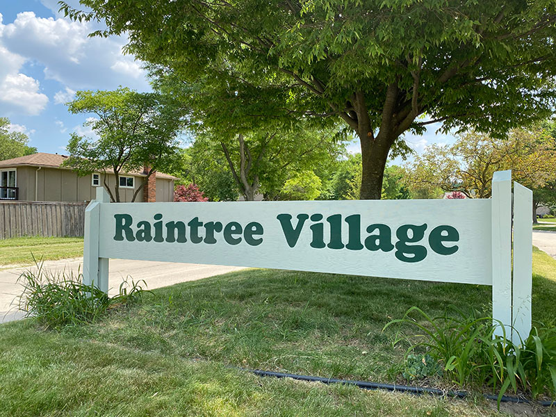 Entrance signs are repainted Raintree Village Homeowners Association